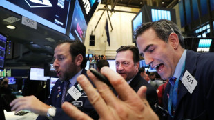 Wall Street conclut en hausse une séance hésitante en attendant l'inflation