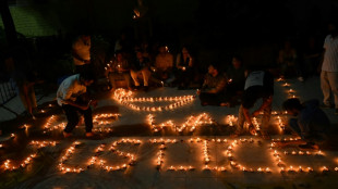 Indians demand justice in candlelight march for murdered doctor