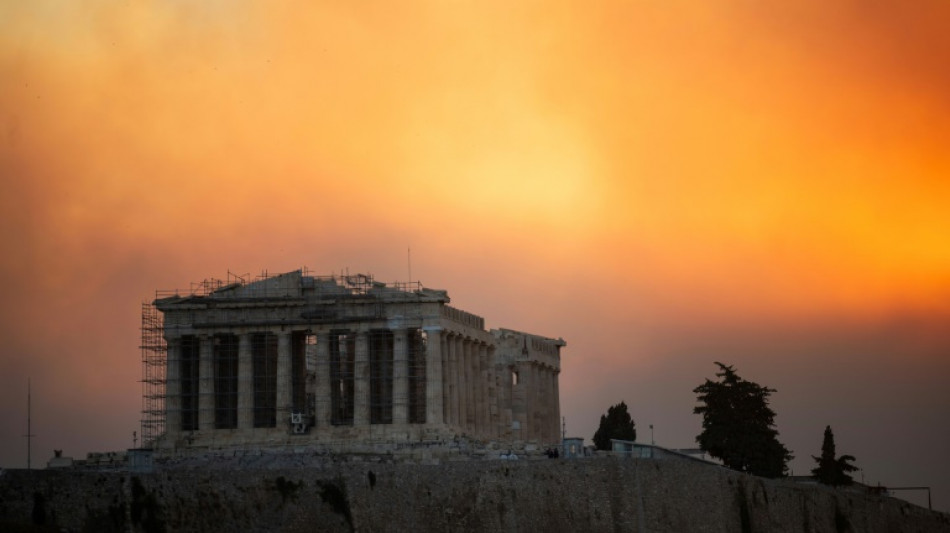 Athens suburbs on fire as Greece calls on EU for help