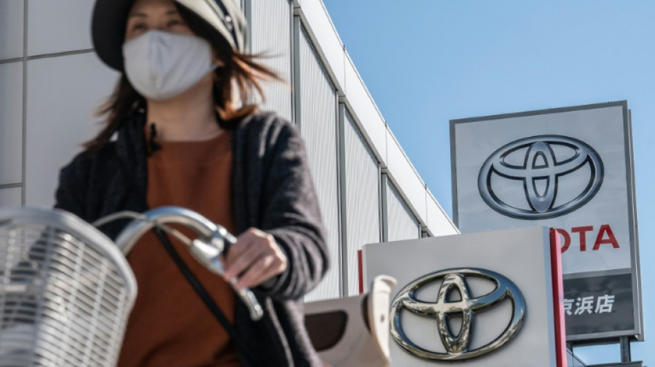 Toyota third-quarter net profit drops but keeps full-year forecasts