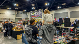 At California gun fair, few speak of recent massacres