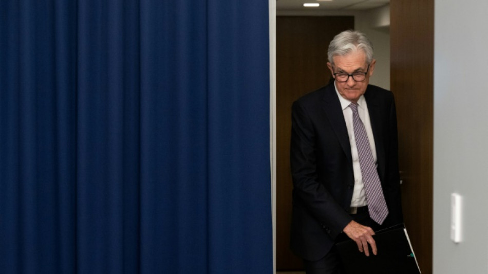 Fed pauses interest rate hikes but signals more tightening ahead