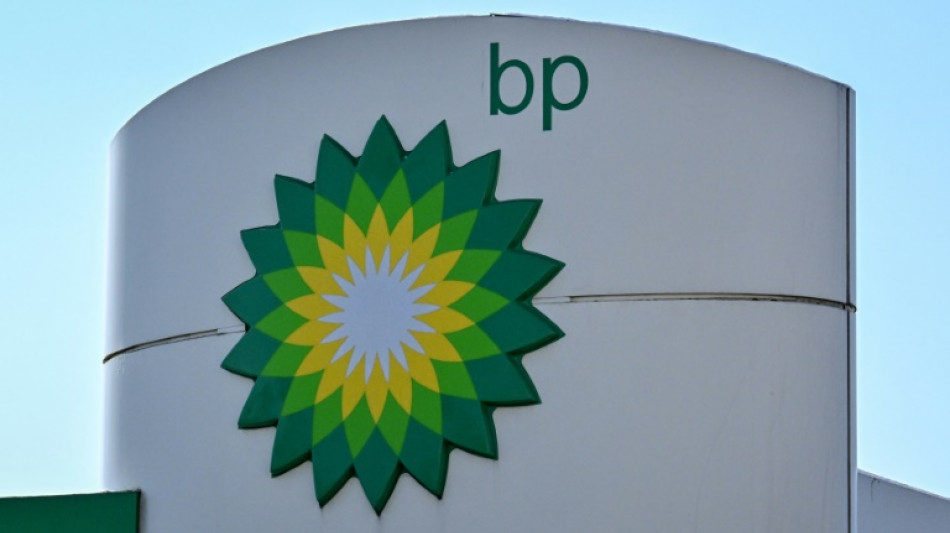 BP posts record profit, dilutes green target