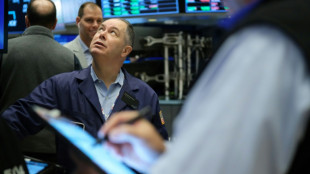 Wall Street finit dans le rouge après le ton plus strict de la Fed