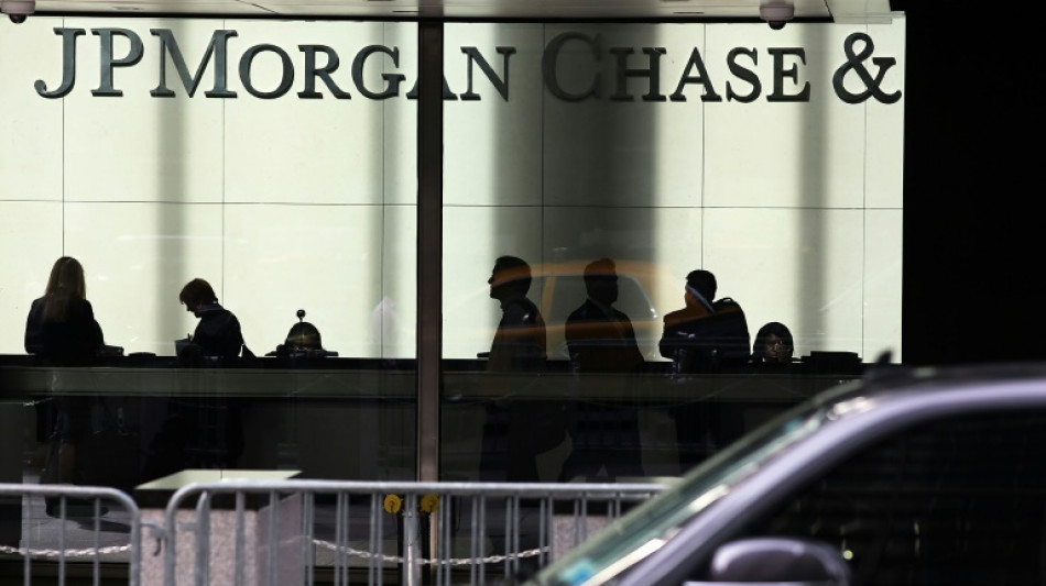 JPMorgan Chase reports lower profits, warns of economic 'headwinds' 