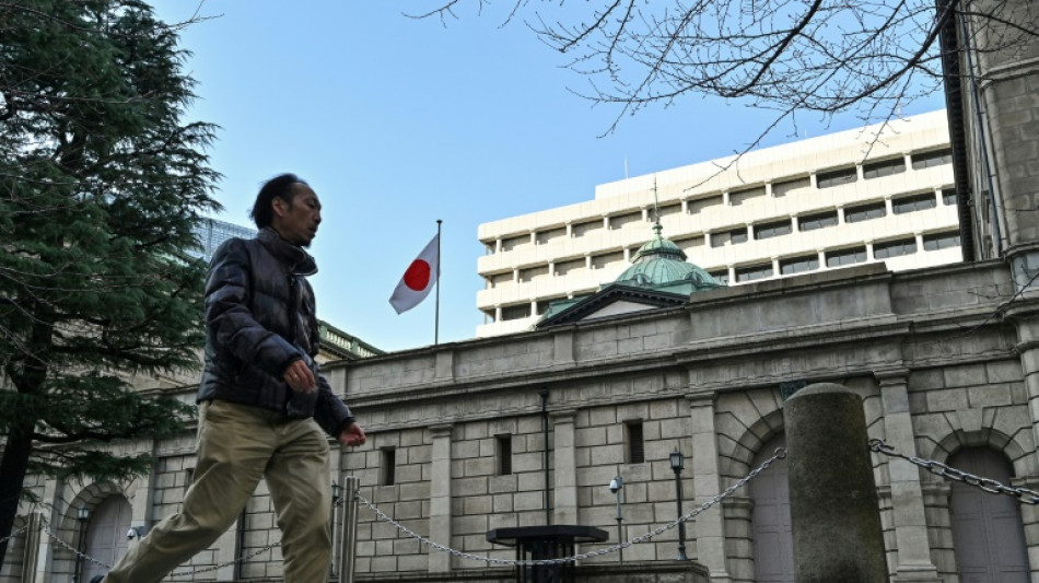 Bank of Japan holds rates and warns of trade uncertainty