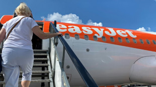 UK airline easyJet cuts losses on strong demand